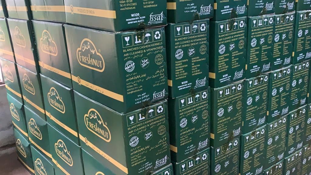 A pallet of green export cartons of cashew kernels