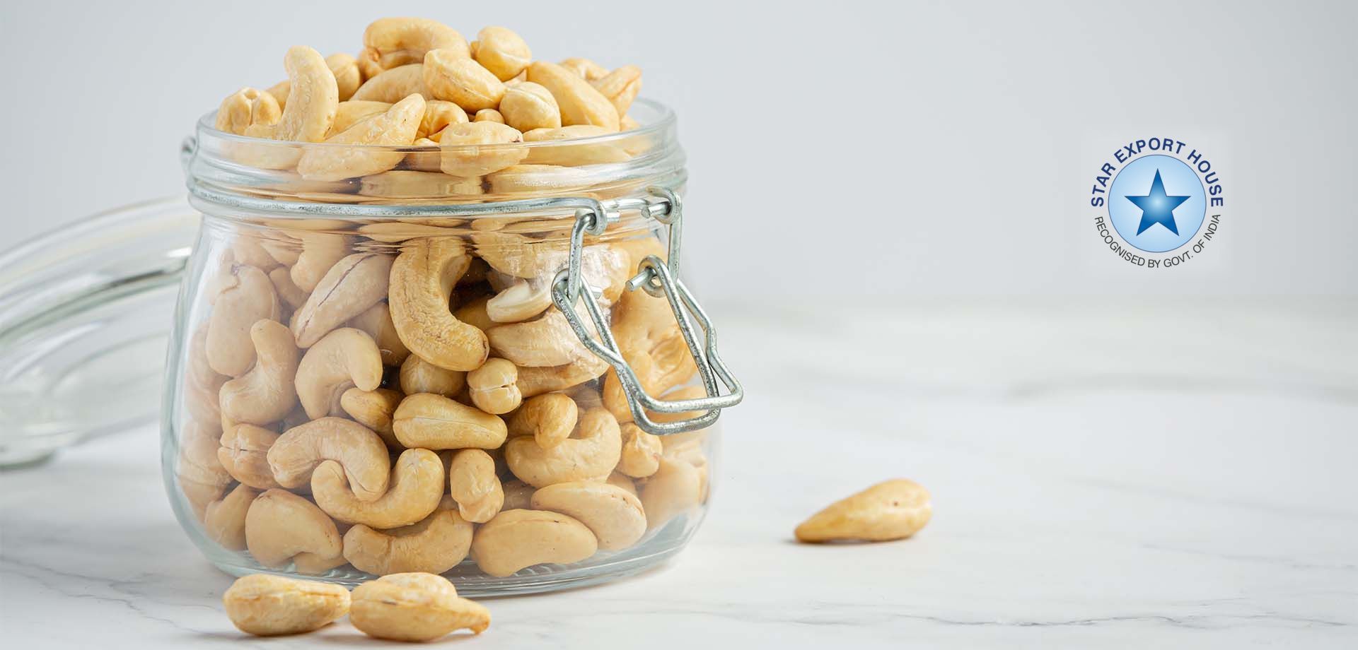 A jar of cashews with the Star Export House badge on the right